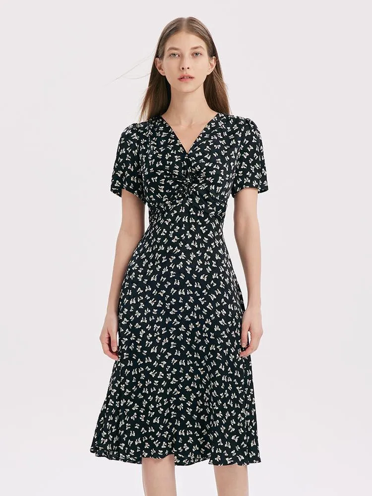 Robe midi torsadée à col en V