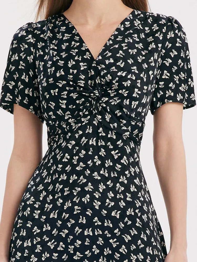 Robe midi torsadée à col en V